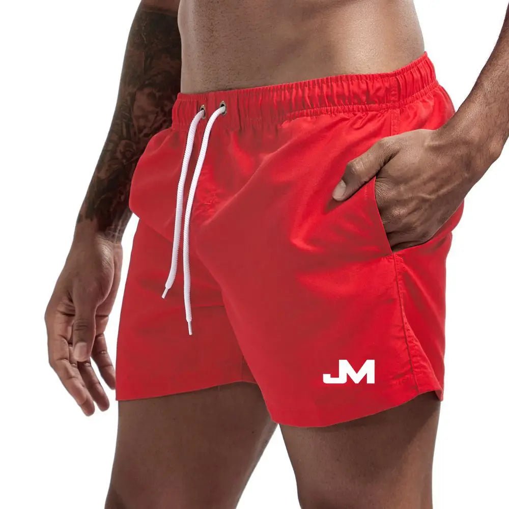 Quick drying, mid-length beach shorts Red Beachwear Australia