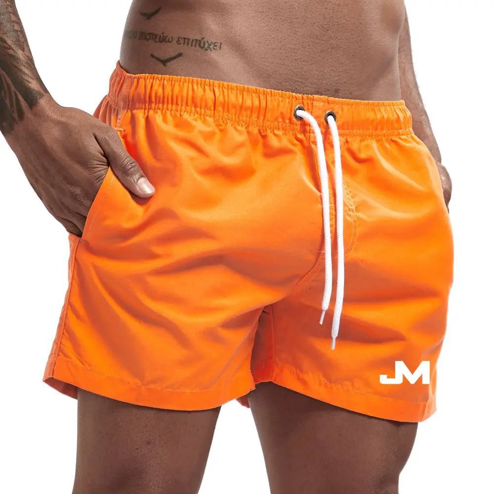 Quick drying, mid-length beach shorts Orange Beachwear Australia